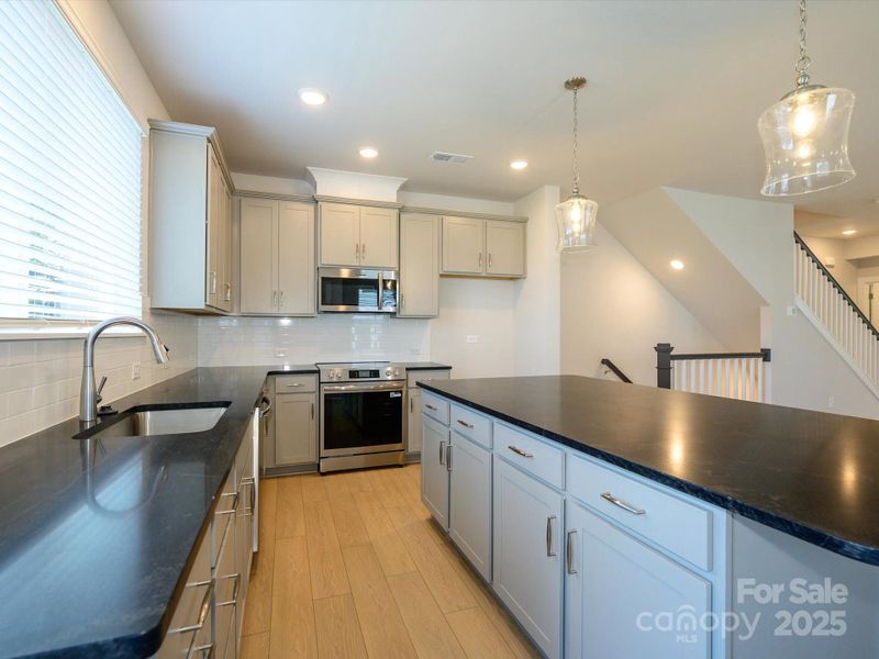 Furnished interior view inside a new home in Central Living at Craig, Charlotte (Image 6).