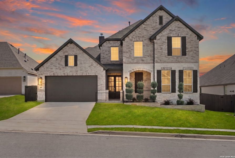 Front exterior of a new home in Ventana, Bulverde, TX, highlighting curb appeal (Image 26). Front exterior of a new home in Ventana, Bulverde, TX, highlighting curb appeal (Image 26).