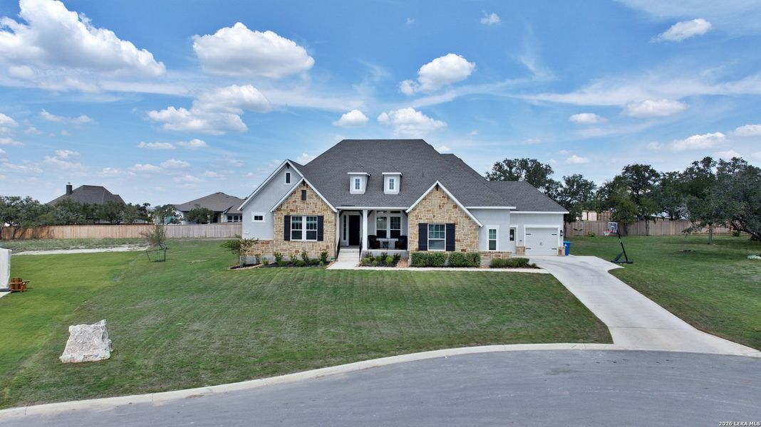 Front exterior of a new home in , Castroville, TX, highlighting curb appeal (Image 22).