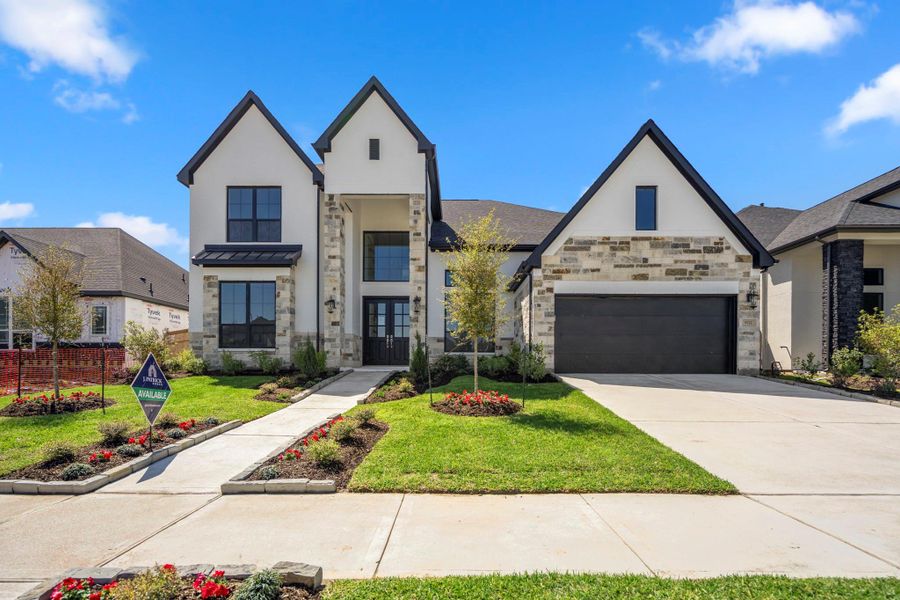 Front exterior of a new home in Sienna 70' Lots, Missouri City, TX, highlighting curb appeal (Image 27). Front exterior of a new home in Sienna 70' Lots, Missouri City, TX, highlighting curb appeal (Image 27).
