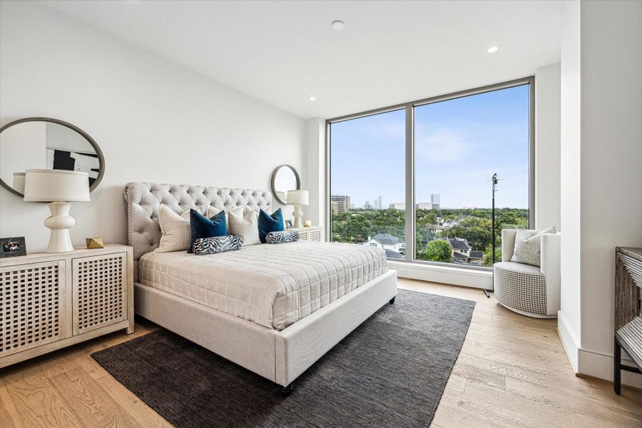 Primary bedroom featuring floor-to-ceiling windows Spectacular Southern views Primary bedroom featuring floor-to-ceiling windows Spectacular Southern views