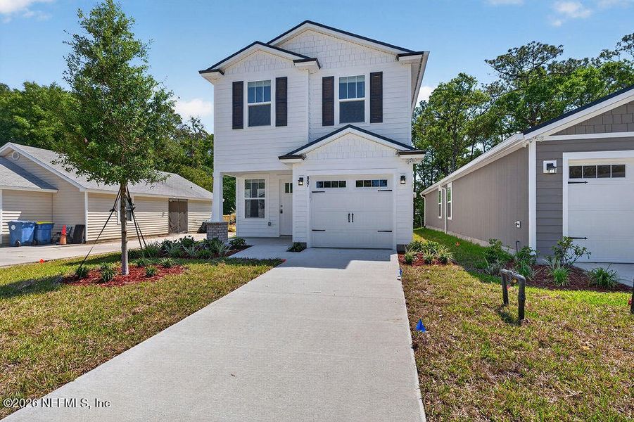 Front exterior of a new home in , Jacksonville, FL, highlighting curb appeal (Image 26).