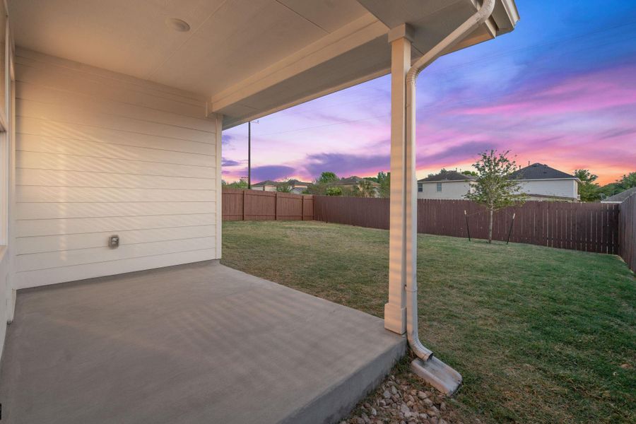 Patio terrace at dusk featuring a patio and a fenced backyard Patio terrace at dusk featuring a patio and a fenced backyard