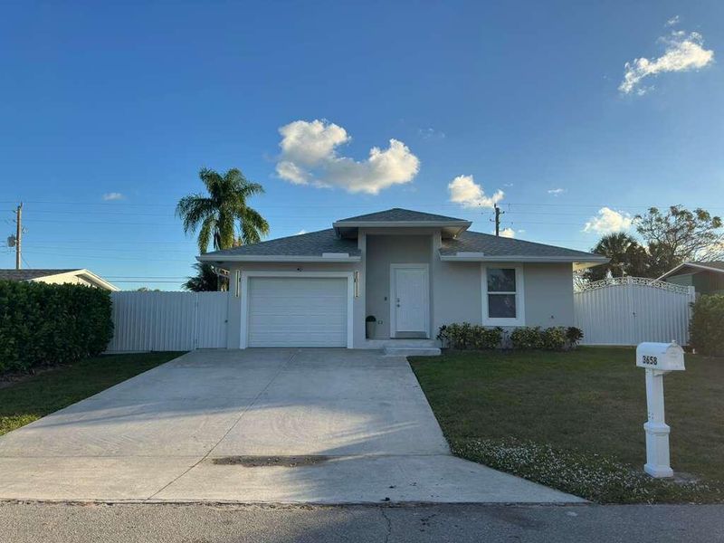 Front exterior of a new home in , West Palm Beach, FL, highlighting curb appeal (Image 1). Front exterior of a new home in , West Palm Beach, FL, highlighting curb appeal (Image 1).
