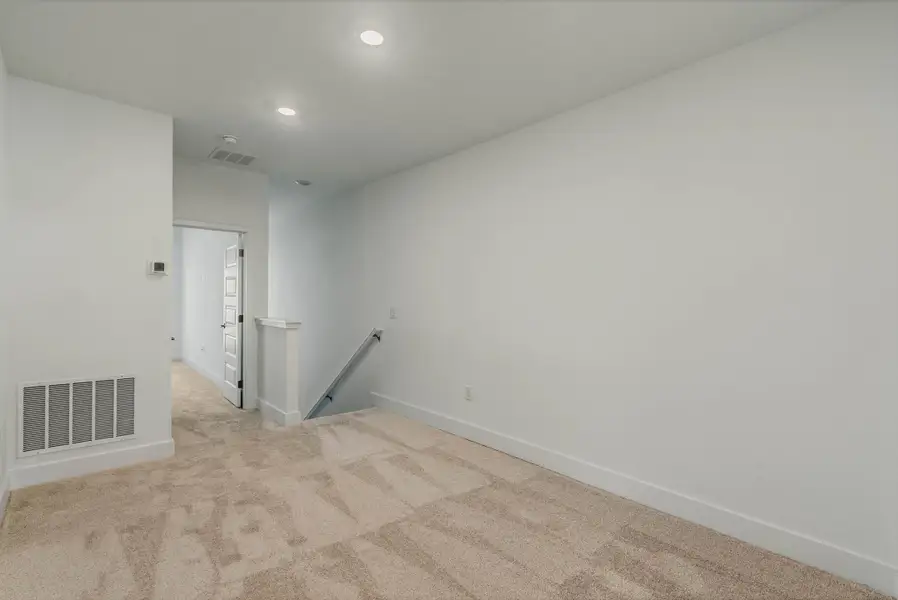 Spacious, unfurnished interior of a new home in Harvest at Ovation - Townhomes, Winter Garden (Image 20).