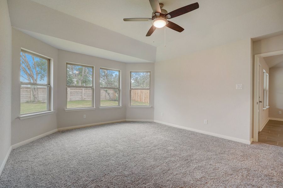 Primary suite bedroom in the Oleander floorplan at a Meritage Homes community.