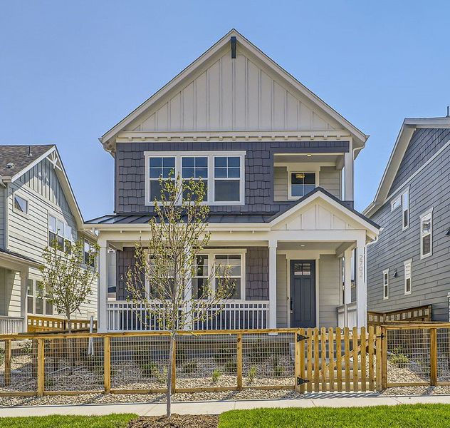 Front exterior of a new home in Arras Park, Thornton, CO, highlighting curb appeal (Image 28). Front exterior of a new home in Arras Park, Thornton, CO, highlighting curb appeal (Image 28).
