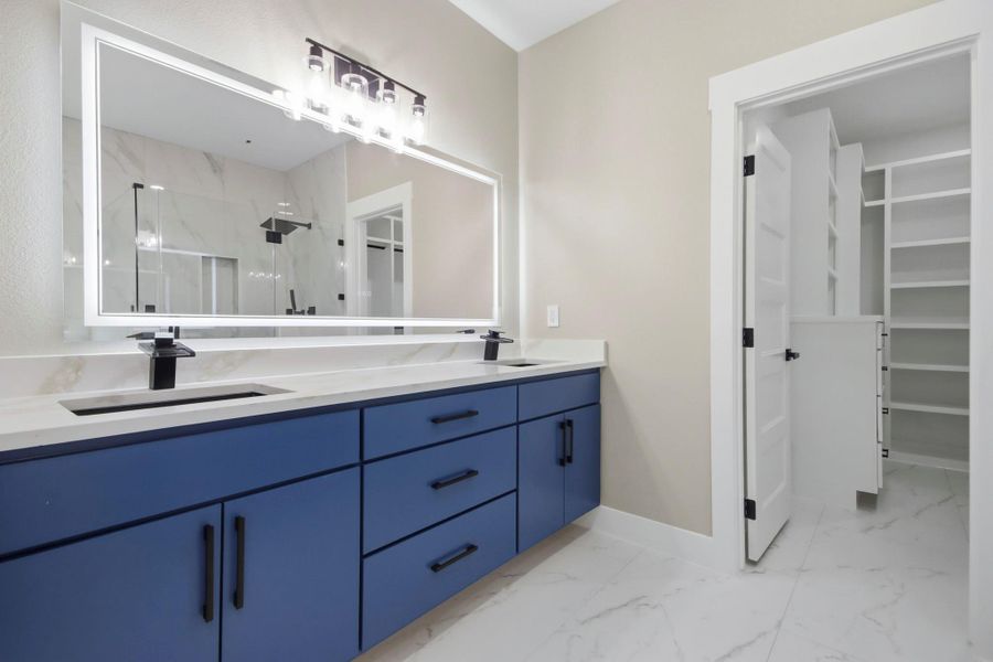 This primary retreat blends ultra-modern amenities with smart functionality. Highlights include a spacious double-sink vanity, high-end quartz countertops, and a striking smart LED mirror. This primary retreat blends ultra-modern amenities with smart functionality. Highlights include a spacious double-sink vanity, high-end quartz countertops, and a striking smart LED mirror.