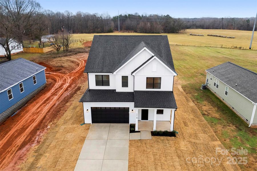 Front exterior of a new home in , Troutman, NC, highlighting curb appeal (Image 29). Front exterior of a new home in , Troutman, NC, highlighting curb appeal (Image 29).