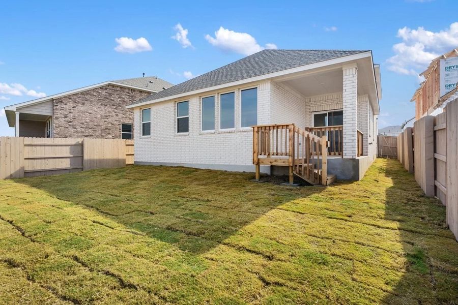 Exterior details and patio area of a home in The Colony, Bastrop (Image 25).