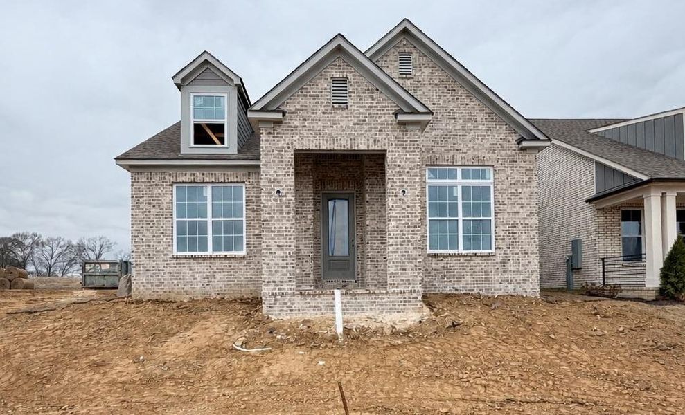 View of front of home featuring brick siding
