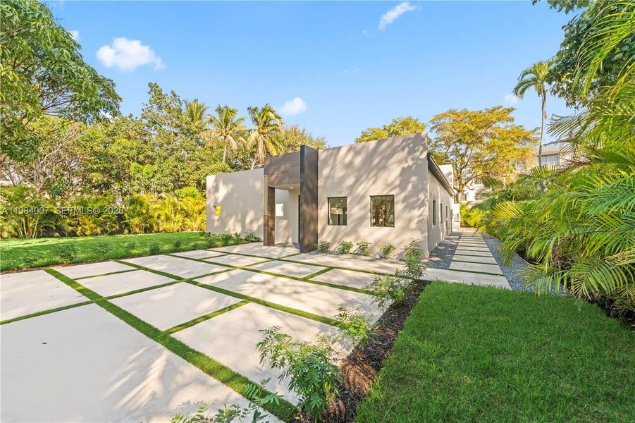Front exterior of a new home in , North Miami, FL, highlighting curb appeal (Image 28).