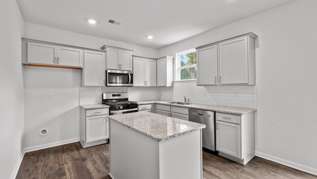Representative furnished interior of a home built from the Biltmore by D.R. Horton in Woodglen, Piedmont (Image 6).