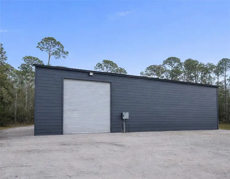 Exterior details and patio area of a home in , New Smyrna Beach (Image 3).