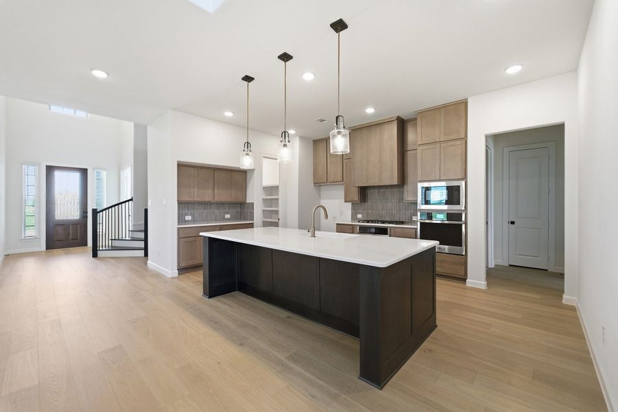 Furnished interior view inside a new home in Green Meadows, Celina (Image 6).