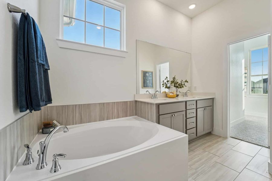 Representative furnished interior of a home built from the Margaux – Chateau Collection by Chesmar Homes in Bridgeland, Cypress (Image 13).