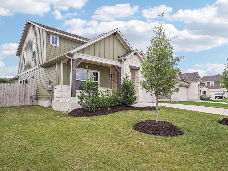 Front exterior of a new home in Riverbend at Double Eagle - Boulevard Collection, Cedar Creek, TX, highlighting curb appeal (Image 20). Front exterior of a new home in Riverbend at Double Eagle - Boulevard Collection, Cedar Creek, TX, highlighting curb appeal (Image 20).