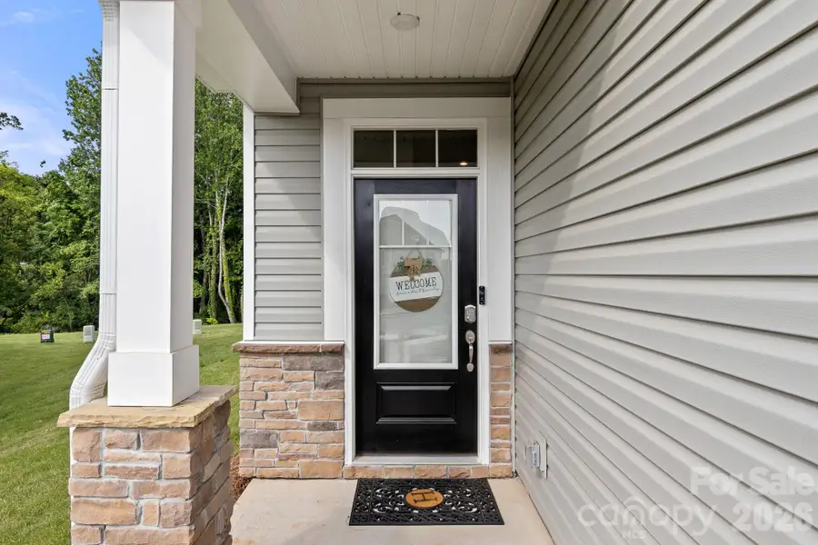 Exterior details and patio area of a home in Hedgecliff Townes, Concord (Image 23). Exterior details and patio area of a home in Hedgecliff Townes, Concord (Image 23).