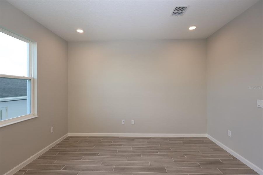 Spacious, unfurnished interior of a new home in Tribute at Ovation, Winter Garden (Image 29).