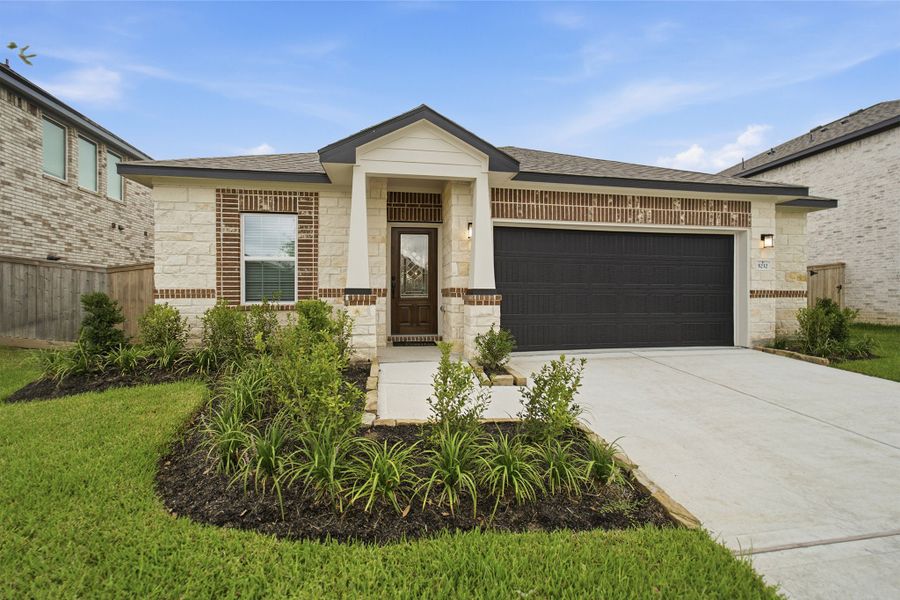 Front exterior of a new home in Massey Oaks, Pearland, TX, highlighting curb appeal (Image 2).