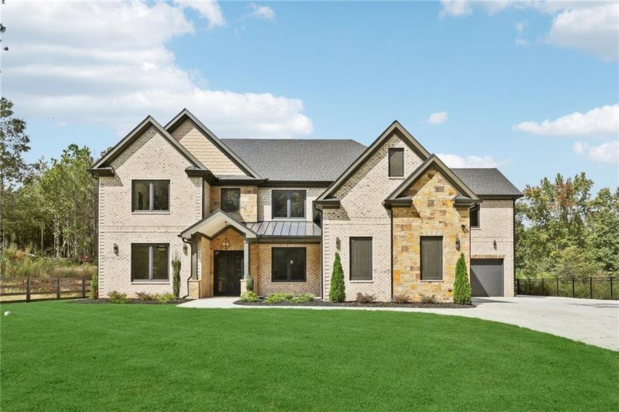 Front exterior of a new home in , Lawrenceville, GA, highlighting curb appeal (Image 1).