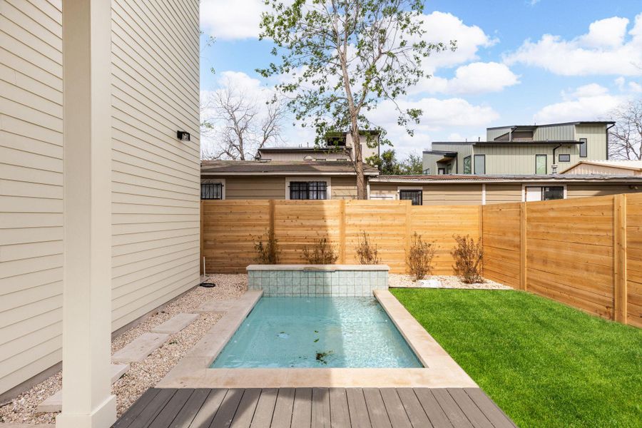 View of pool featuring a fenced backyard and a deck View of pool featuring a fenced backyard and a deck
