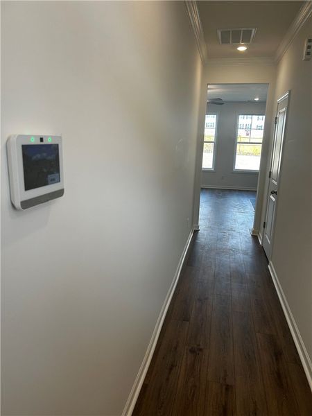 This inviting hallway offers a warm welcome, conne