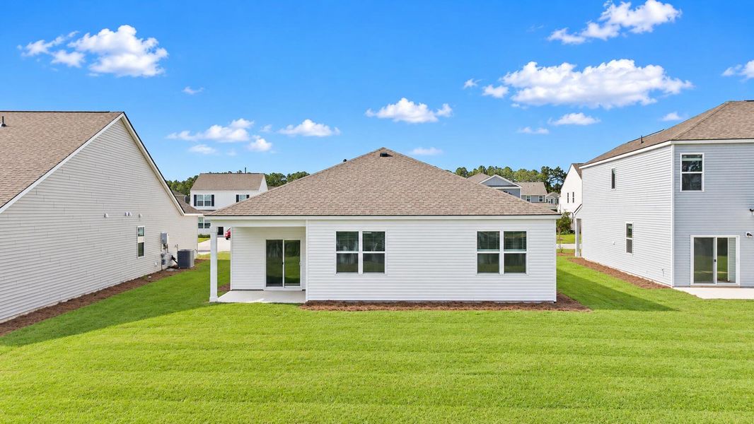 Exterior details and patio area of a home in Pine Hills at Cane Bay, Summerville (Image 3).