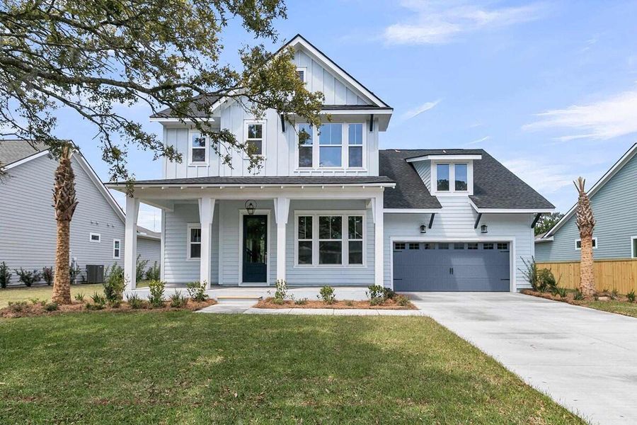 Front exterior of a new home in Hidden Ponds Reserve, Awendaw, SC, highlighting curb appeal (Image 1).