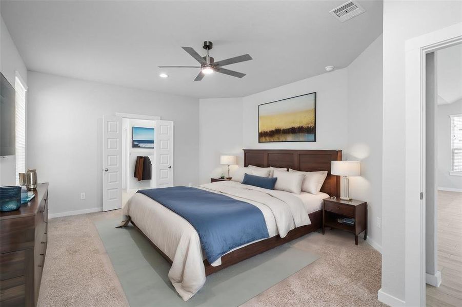 Come and unwind after a long day in this magnificent primary suite! This spacious room features plush carpet, warm paint, high ceilings, and large windows with privacy blinds!