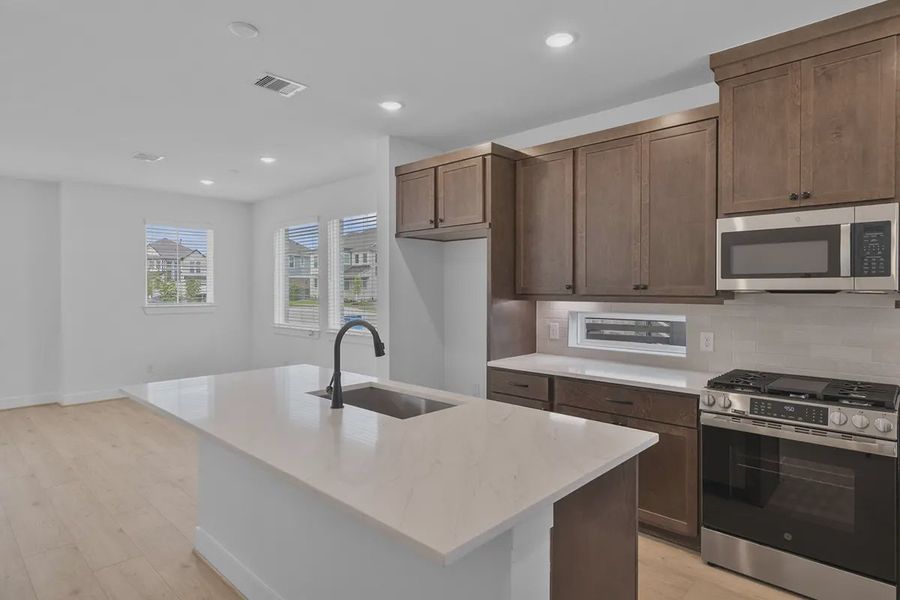 Furnished interior view inside a new home in Bridgeland Courtyard, Cypress (Image 7).