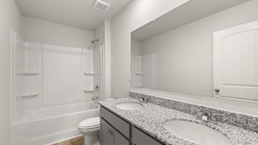 Furnished interior view inside a new home in Northwoods at Mirror Lake, Villa Rica (Image 9).