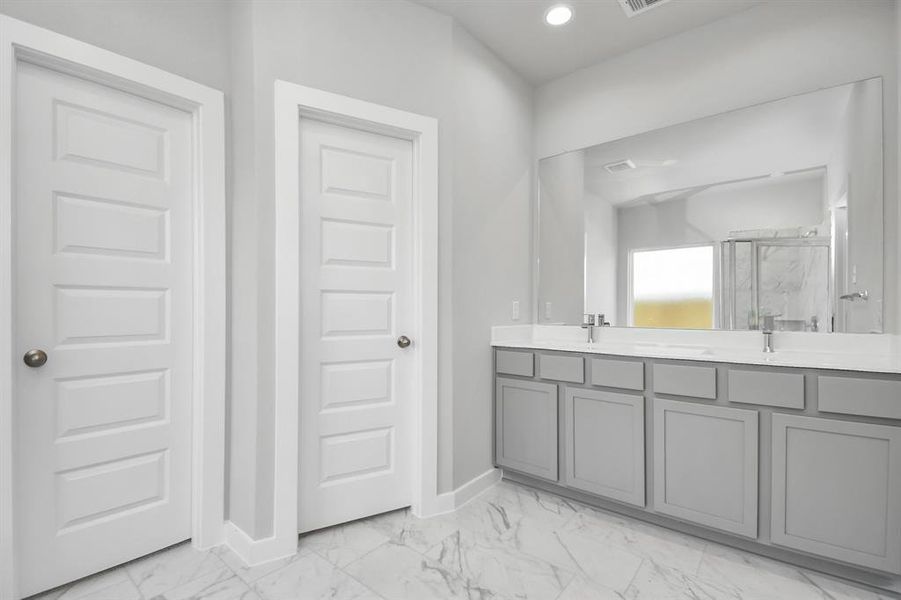 Escape to a spa-like oasis in this primary bathroom. Sample photo of completed home with similar floor plan. As-built interior colors and selections may vary.