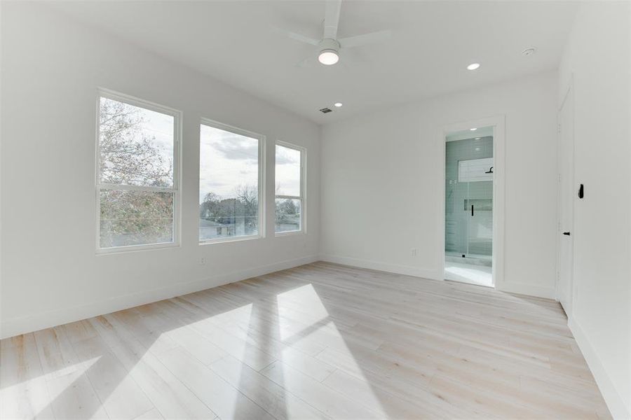 Abundant natural lighting in the primary bedroom