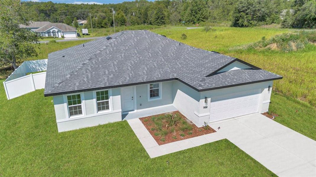 Front exterior of a new home in , Citrus Springs, FL, highlighting curb appeal (Image 22).