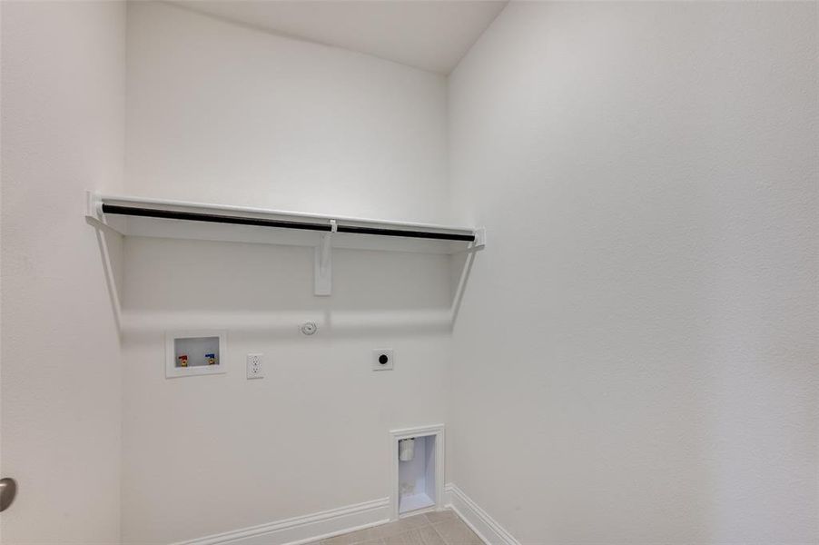 Laundry area featuring gas dryer hookup, electric dryer hookup, and hookup for a washing machine