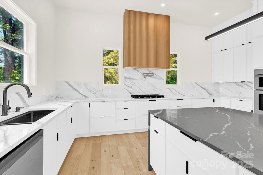 Custom hood, pot filler and SS appliances Custom hood, pot filler and SS appliances