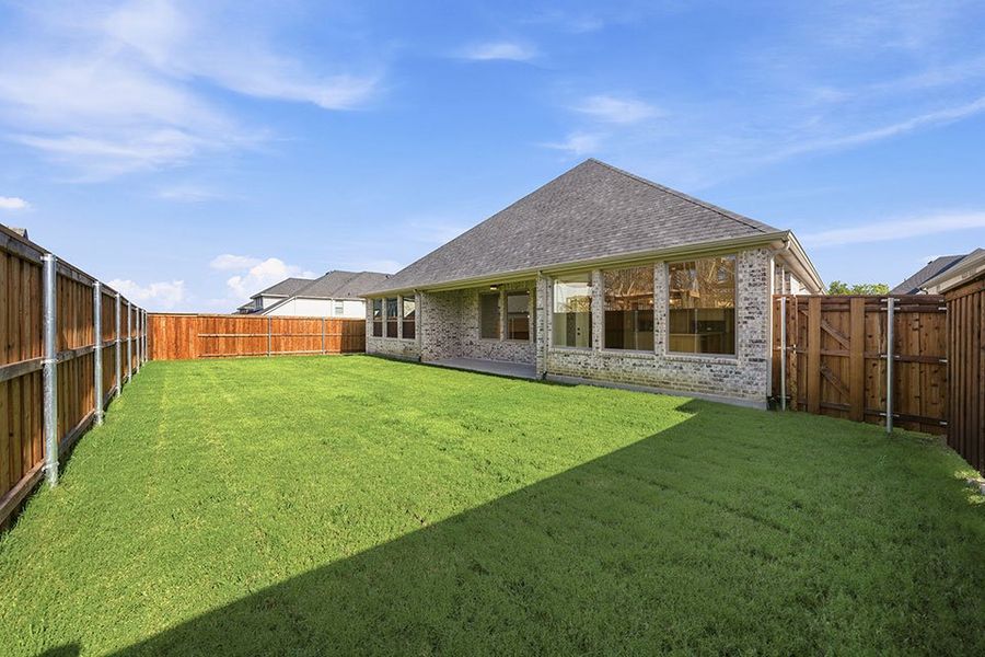 Exterior details and patio area of a home in The Homestead - 62', Rockwall (Image 4).