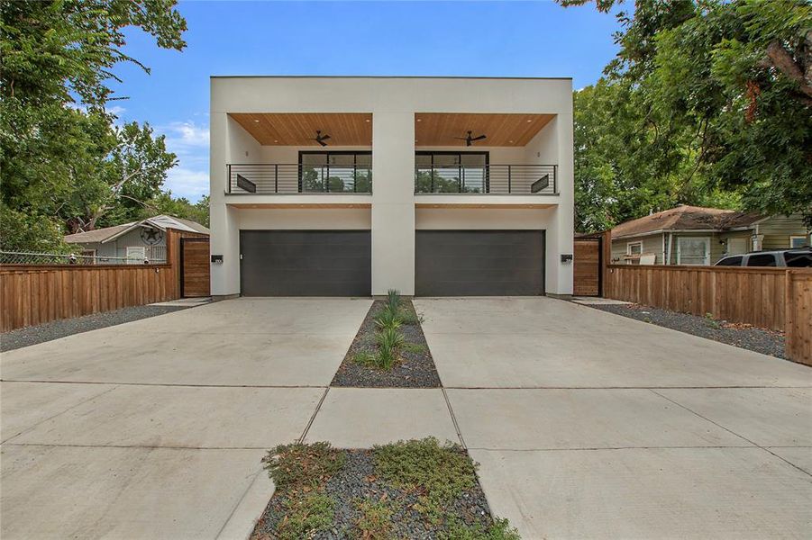 Contemporary house featuring a garage and a balcony