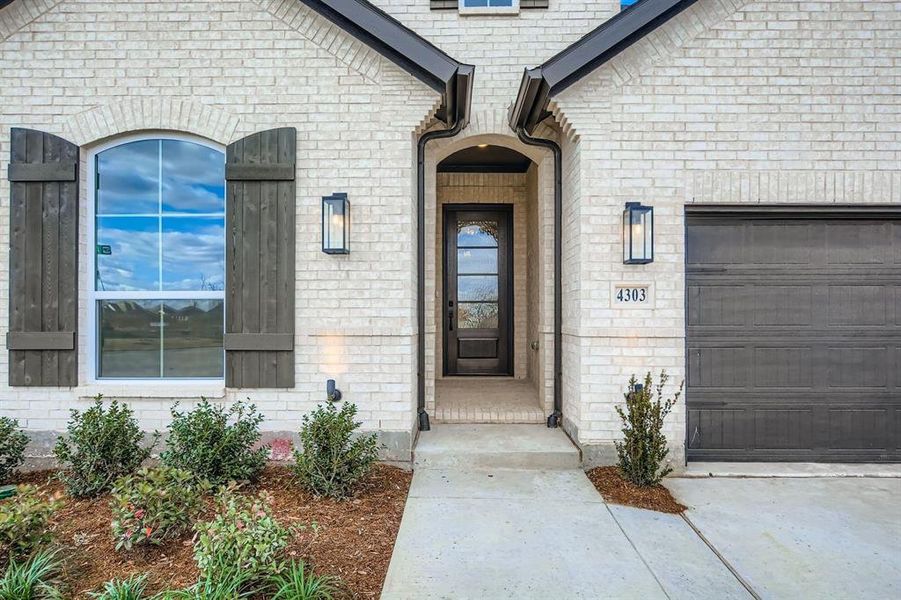 Exterior details and patio area of a home in Wildridge, Oak Point (Image 3).