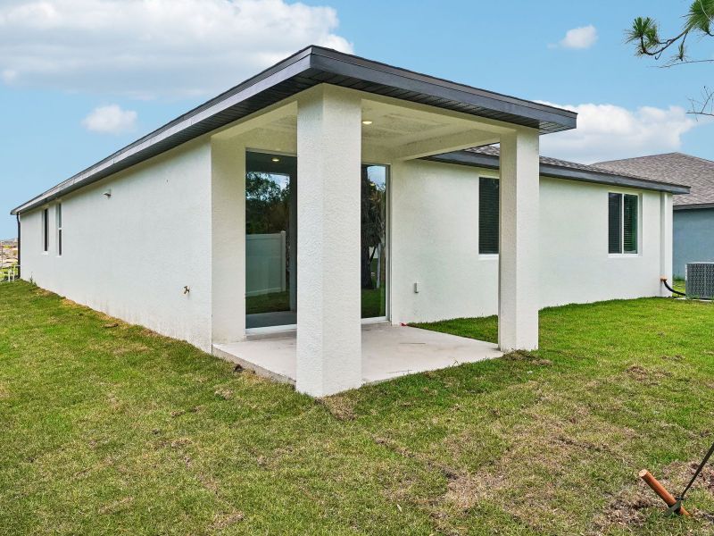 Exterior details and patio area of a home in Pine Ridge Meadows, Hudson (Image 2). Exterior details and patio area of a home in Pine Ridge Meadows, Hudson (Image 2).