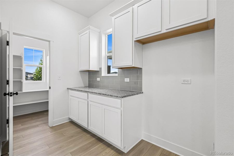 Furnished interior view inside a new home in Painted Prairie Cottage, Aurora (Image 7).