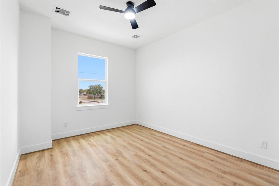 Bedroom #3 upstairs. A forward facing window, spacious closet and NO CARPET anywhere!