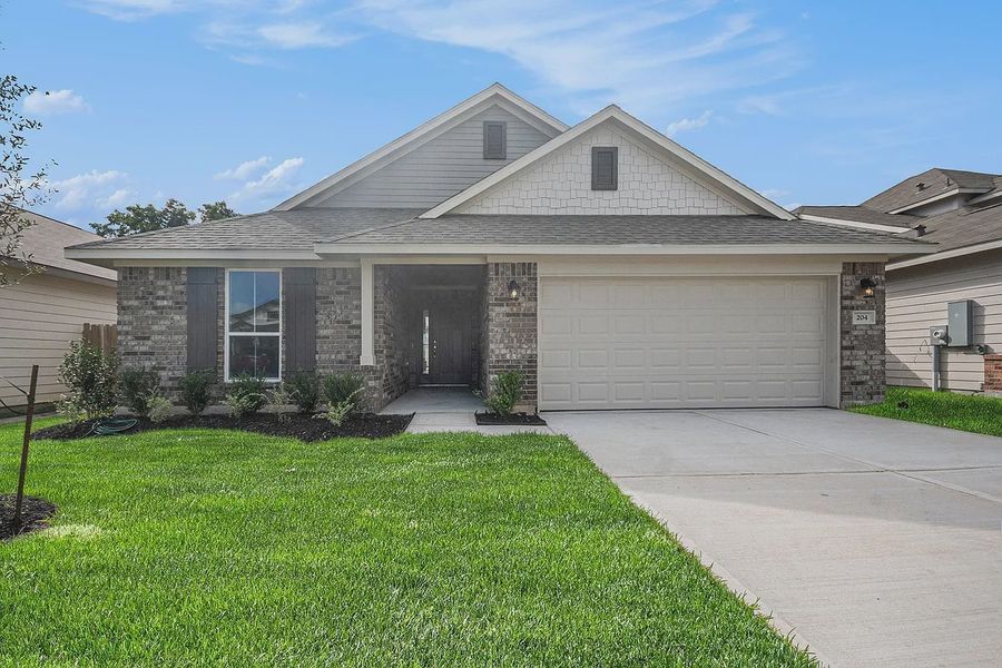 Front exterior of a new home in Kiber Reserve, Angleton, TX, highlighting curb appeal (Image 15). Front exterior of a new home in Kiber Reserve, Angleton, TX, highlighting curb appeal (Image 15).