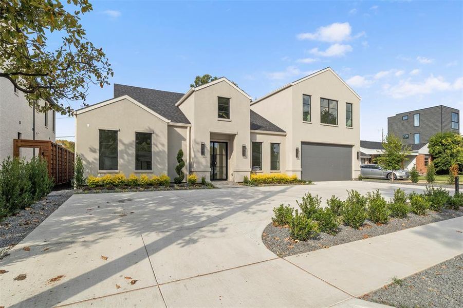 Contemporary home with stucco siding, driveway, a garage, and roof with shingles Contemporary home with stucco siding, driveway, a garage, and roof with shingles