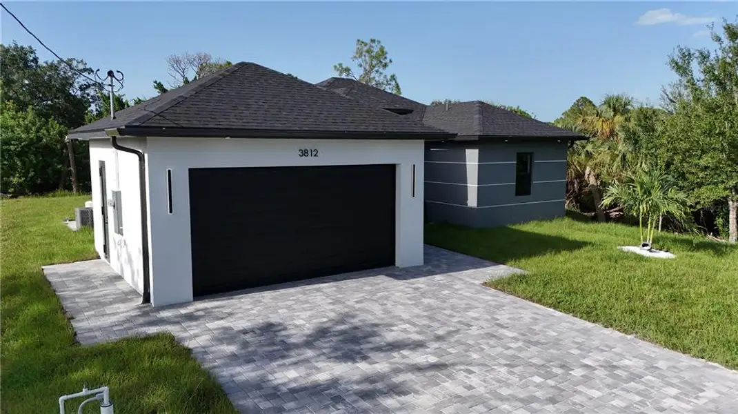 Front exterior of a new home in , Lehigh Acres, FL, highlighting curb appeal (Image 1). Front exterior of a new home in , Lehigh Acres, FL, highlighting curb appeal (Image 1).
