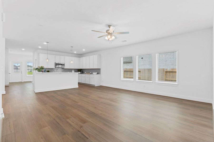 Expansive open-concept living area connects seamlessly to the kitchen and dining space—ideal for entertaining and everyday comfort. **Image Representative of Plan Only and May Vary as Built**.