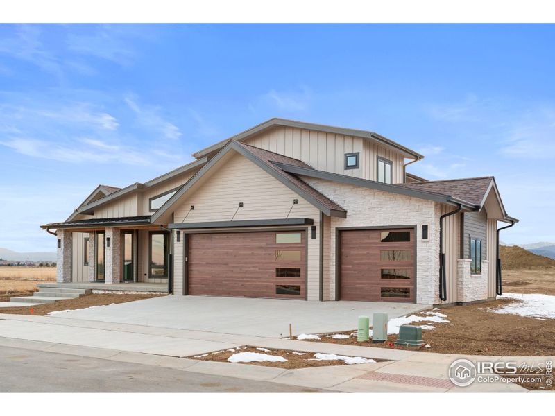 Front exterior of a new home in , Berthoud, CO, highlighting curb appeal (Image 16).