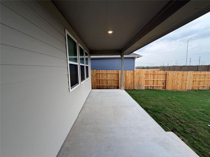 Exterior details and patio area of a home in Willow Springs, Buda (Image 3).