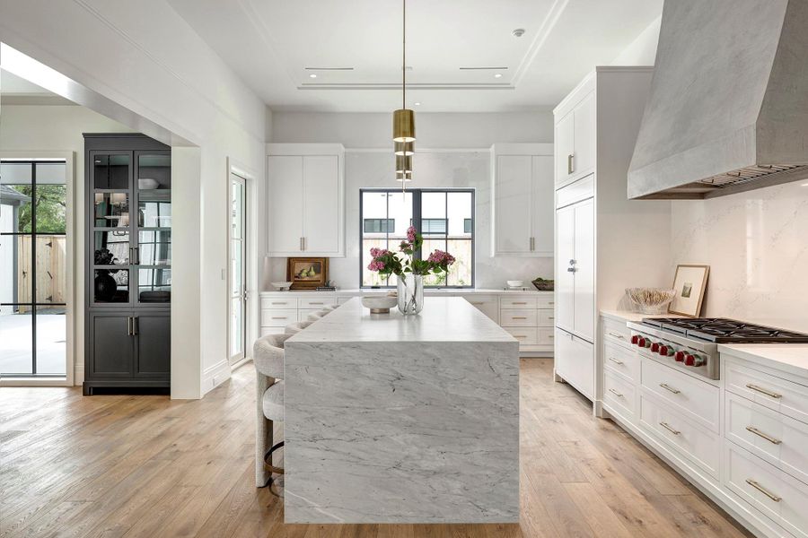 Thoughtfully designed kitchen has Wolf appliances, Sub-Zero refrigerator, and Segreto plaster vent hood.  So functional and tasteful!